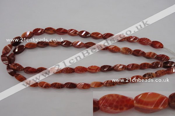 CAG4181 15.5 inches 7*14mm faceted & twisted rice natural fire agate beads