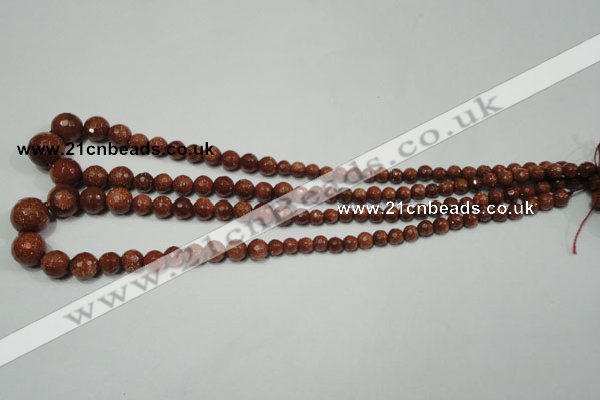 CRO736 15.5 inches 6mm – 14mm faceted round goldstone beads